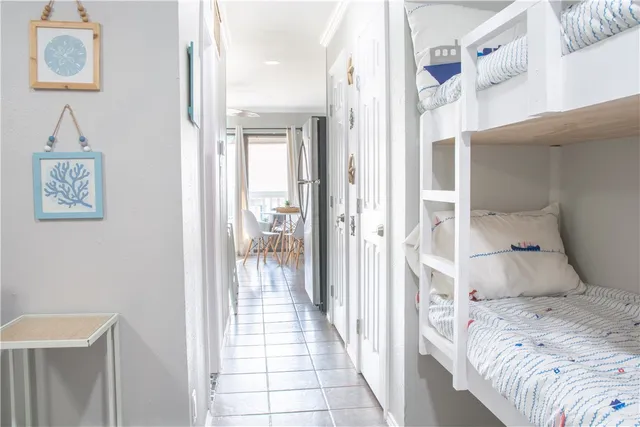 a bedroom with a bed and a view of bathroom