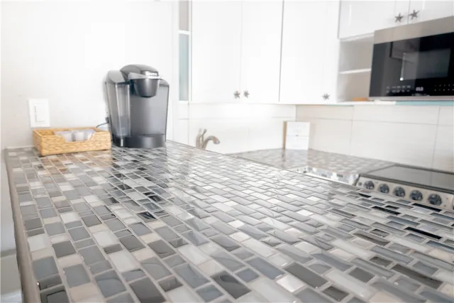 a view of a kitchen with a sink