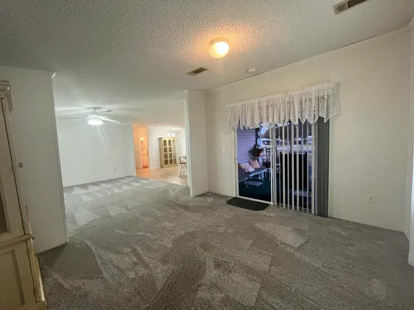 a view of a room with furniture and stairs