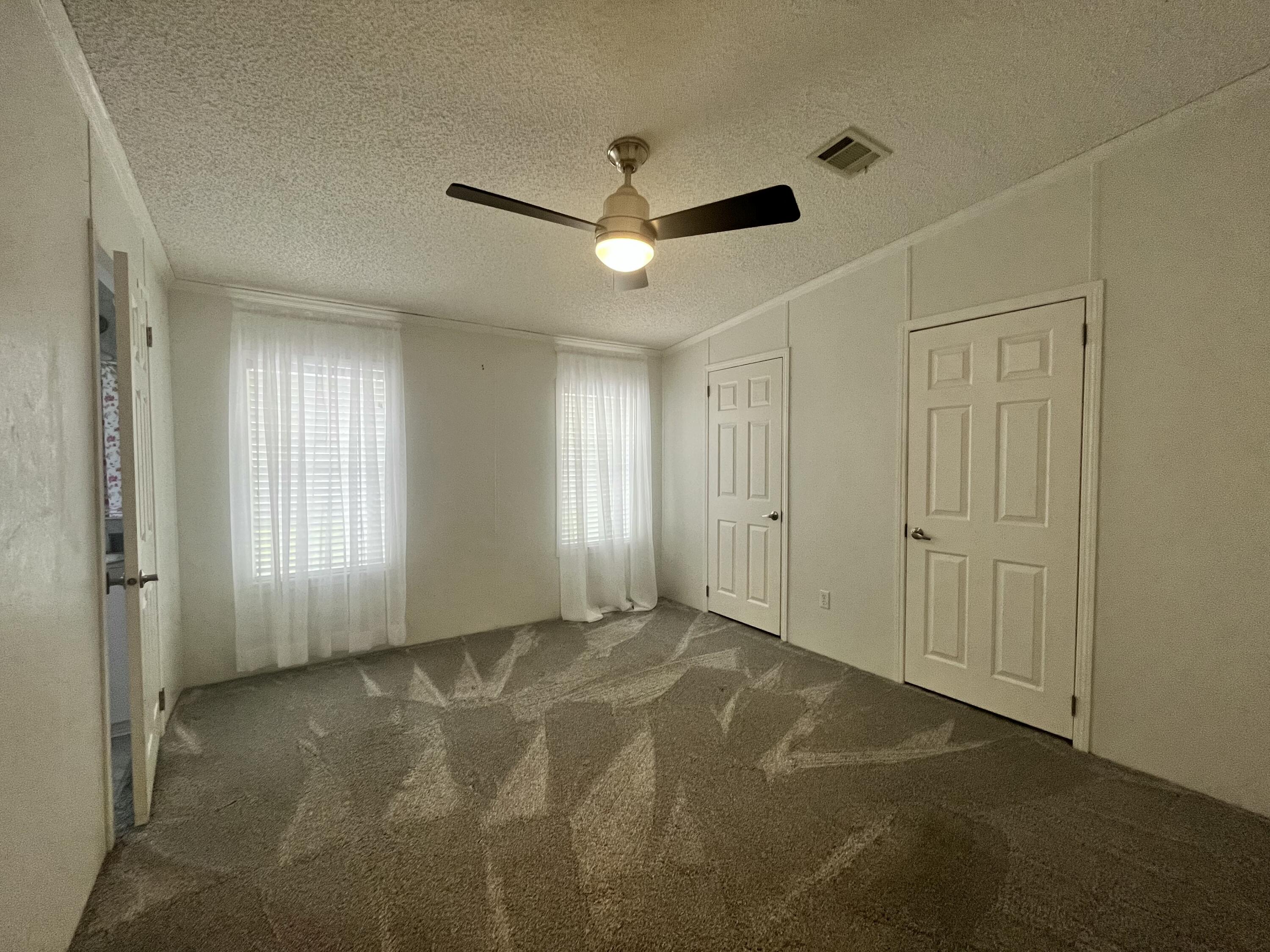 4064 Southwest 9th Way Okeechobee, FL 34974 - Photo 12 of 39 a view of an empty room with a window