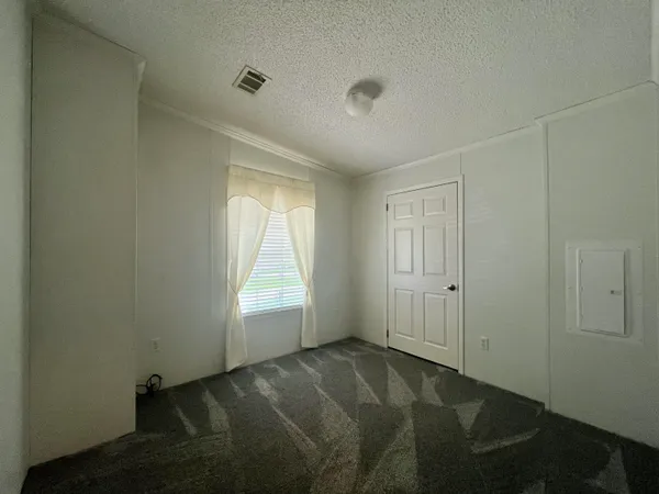 a view of an empty room and window