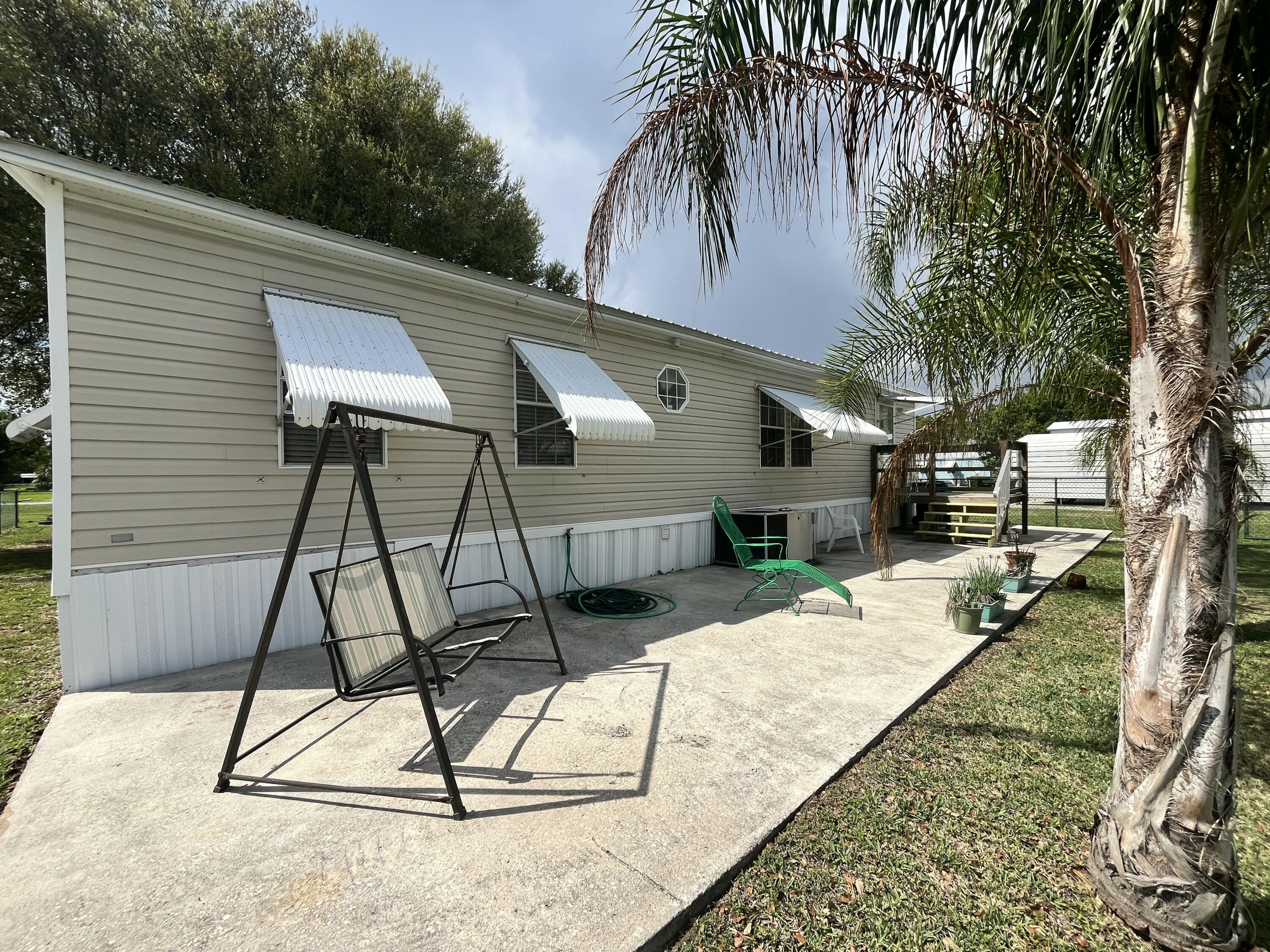 4064 Southwest 9th Way Okeechobee, FL 34974 - Photo 27 of 39 a house view with a backyard space