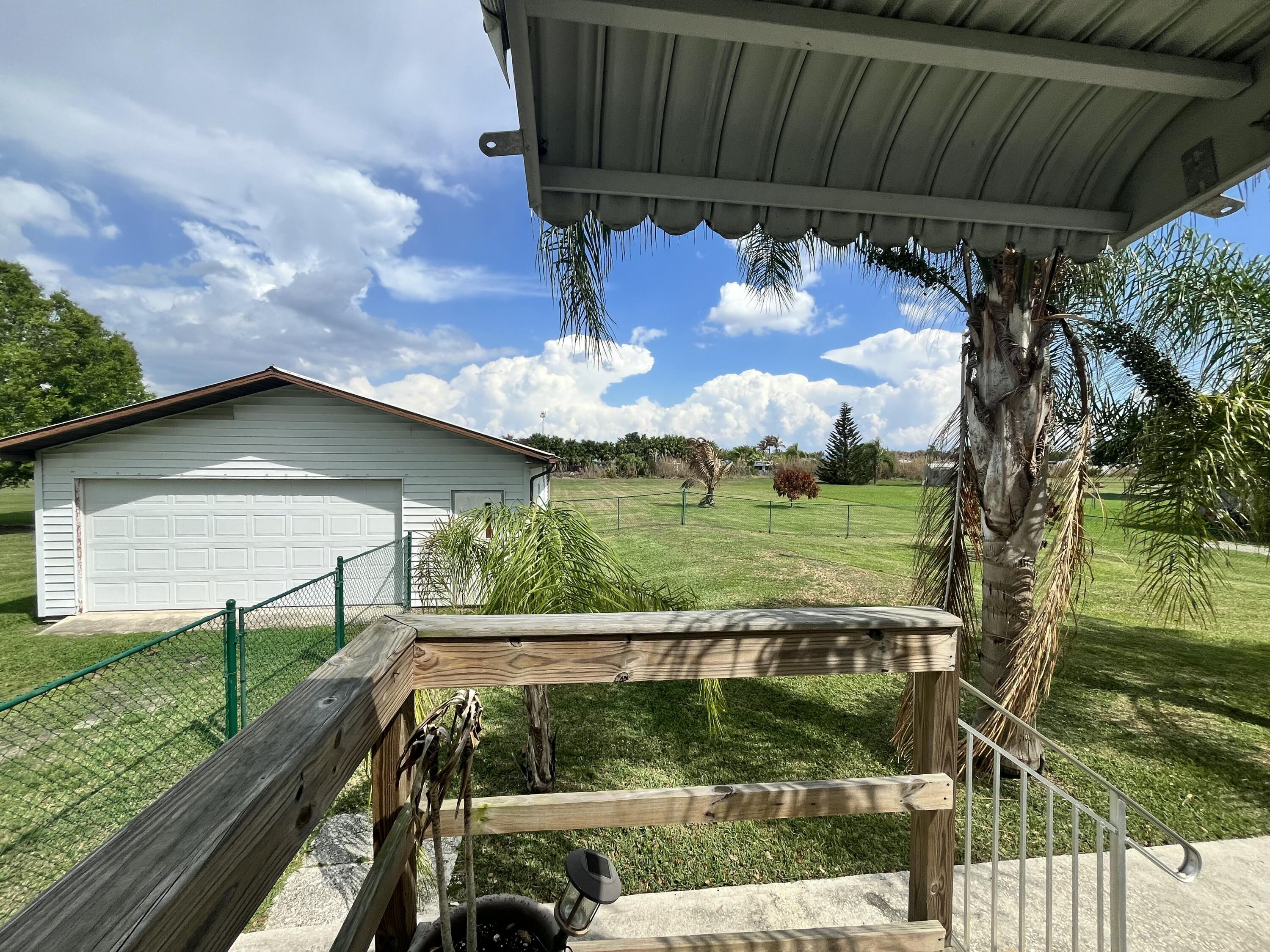 4064 Southwest 9th Way Okeechobee, FL 34974 - Photo 28 of 39 a view of a yard with an outdoor space