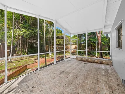 a view of an empty room with a large window