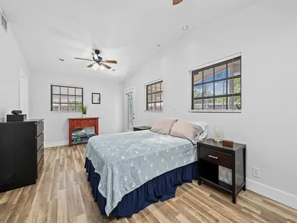 a bedroom with a bed and a dresser