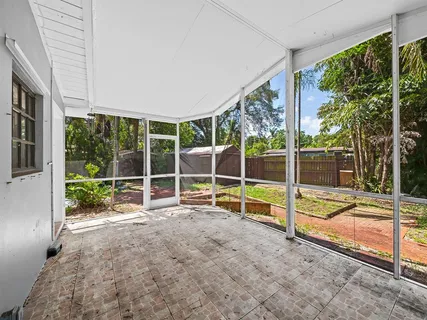 a view of an empty room with floor to ceiling windows and floor to ceiling window