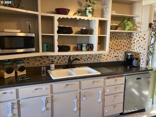 1420 Southwest Goodwin Place Pendleton, OR 97801 - Photo 12 of 27 a kitchen with white cabinets and sink