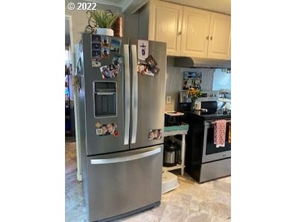 1420 Southwest Goodwin Place Pendleton, OR 97801 - Photo 14 of 27 a view of a kitchen with fridge and workspace