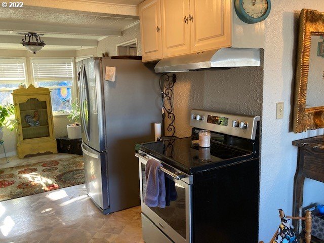 1420 Southwest Goodwin Place Pendleton, OR 97801 - Photo 16 of 27 a kitchen with stainless steel appliances granite countertop a refrigerator and a stove