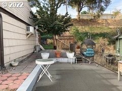 1420 Southwest Goodwin Place Pendleton, OR 97801 - Photo 5 of 27 a backyard of a house with table and chairs
