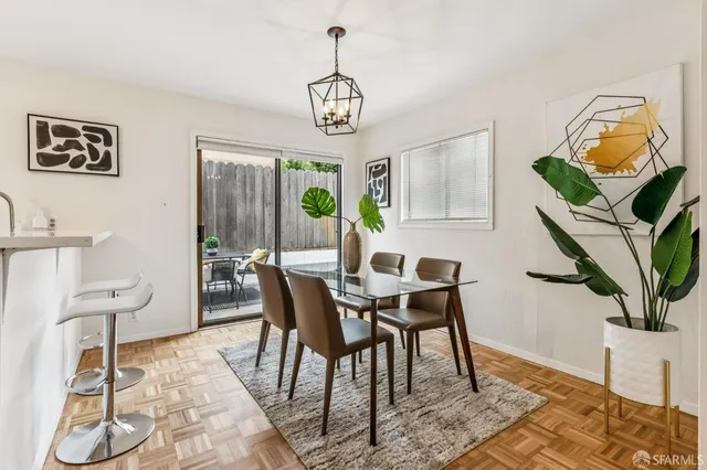 a view of a dining room with furniture window and wooden floor