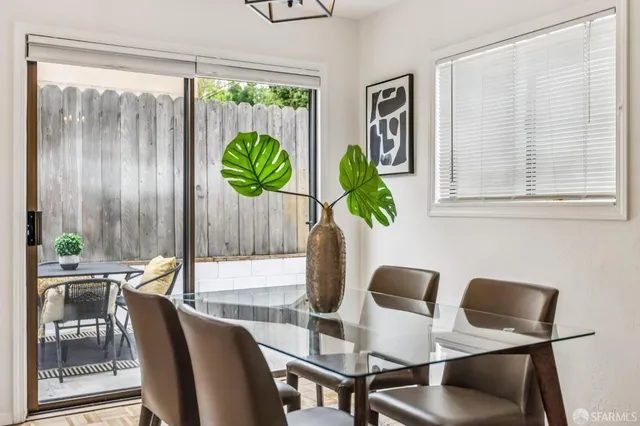 a view of a dining room with furniture window and outside view
