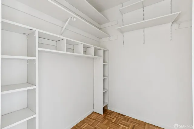 a view of an empty walk in closet