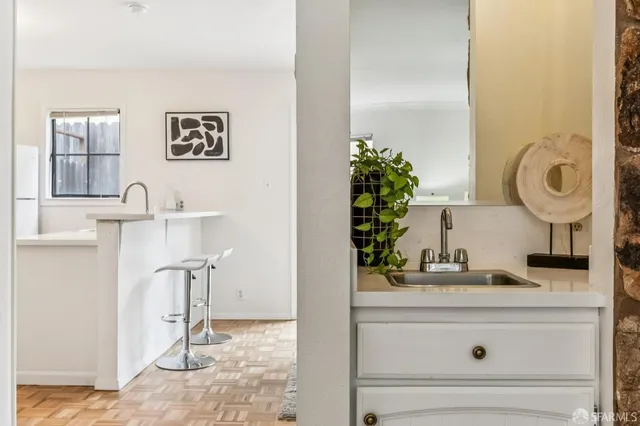 a bathroom with a sink and a mirror