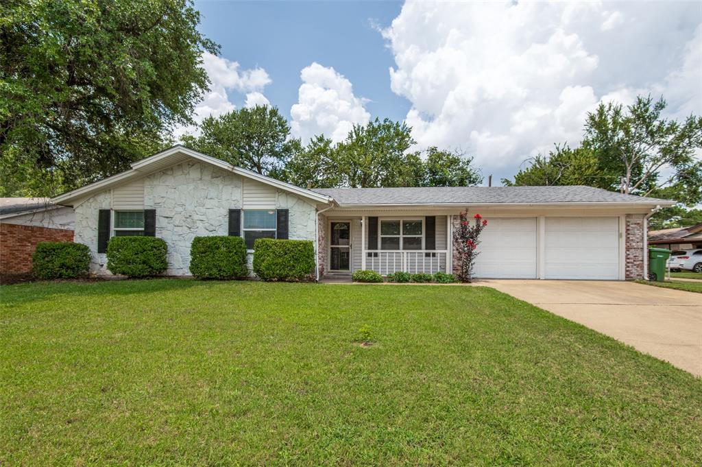 1417 Simpson Drive Hurst, TX 76053 - Photo 1 of 1 a front view of house with yard and green space