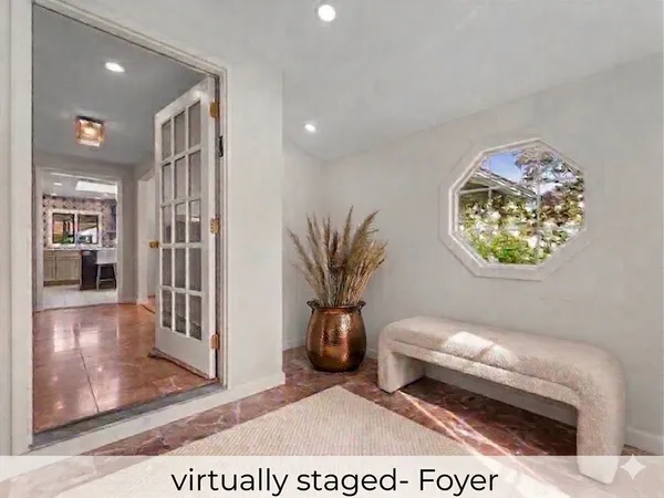 a view of a livingroom with wooden floor and kitchen space