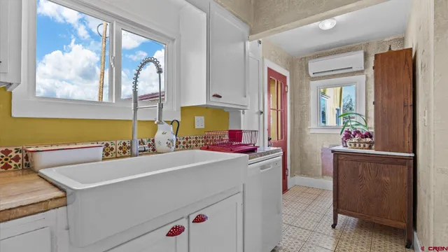 a kitchen with a cabinets and appliances