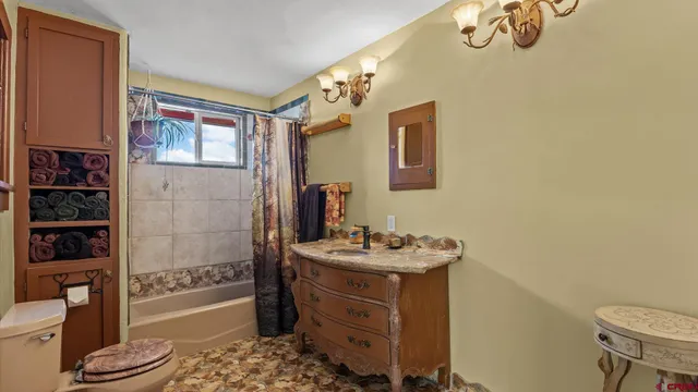 a bedroom with a bed and a table in it