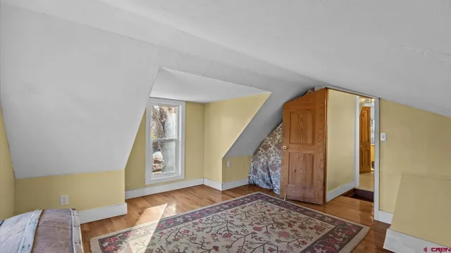 a bathroom with a toilet a sink and a mirror