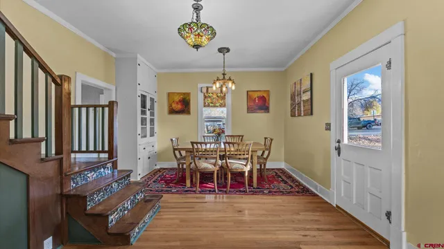 a view of an entryway with wooden floor