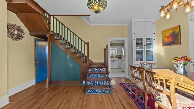 a living room with furniture fireplace and a large window