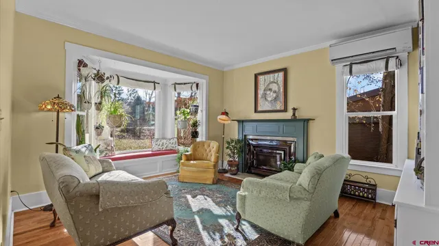 a living room with furniture and a fireplace