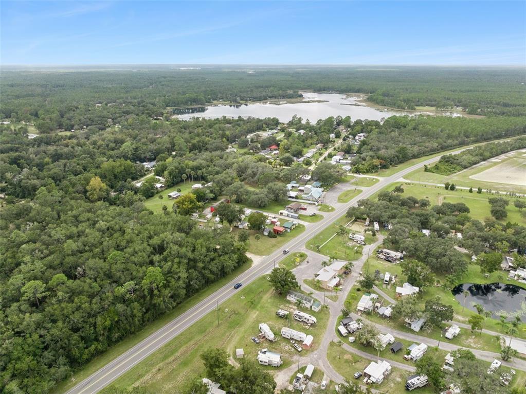 21944 Highway 40 Astor, FL 32102 - Photo 17 of 18 an aerial view of residential houses with outdoor space and trees