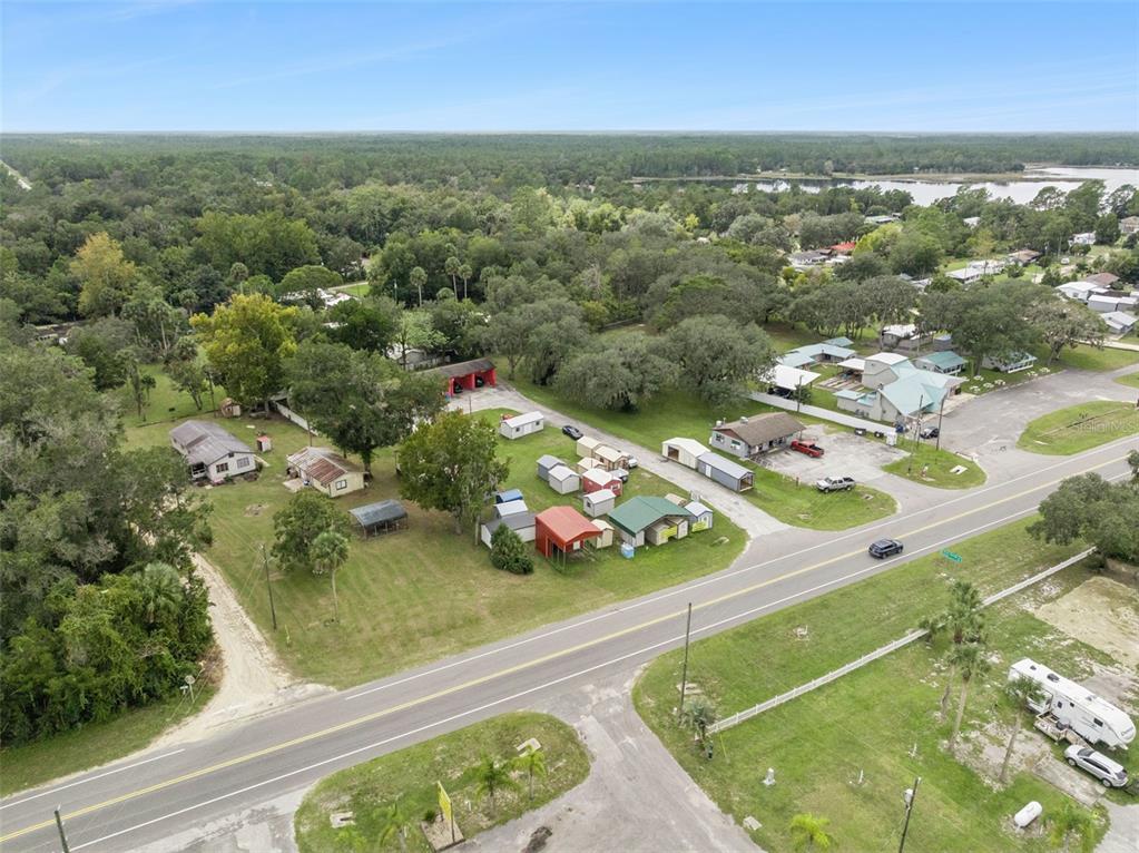 21944 Highway 40 Astor, FL 32102 - Photo 18 of 18 an aerial view of residential houses with outdoor space and trees