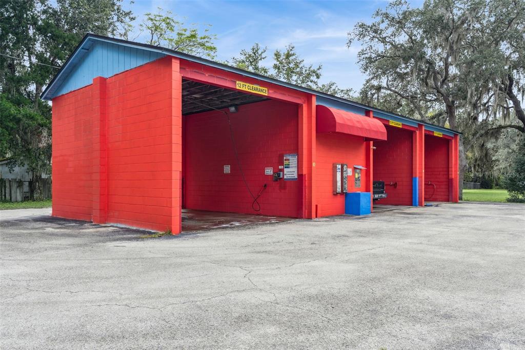 21944 Highway 40 Astor, FL 32102 - Photo 3 of 18 a view of a house with yard and garage