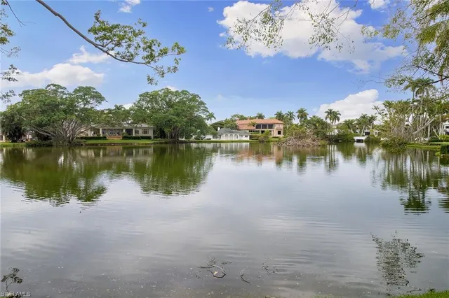 a view of a lake with a building in the background