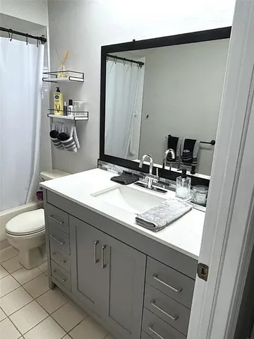 a bathroom with a sink and toilet