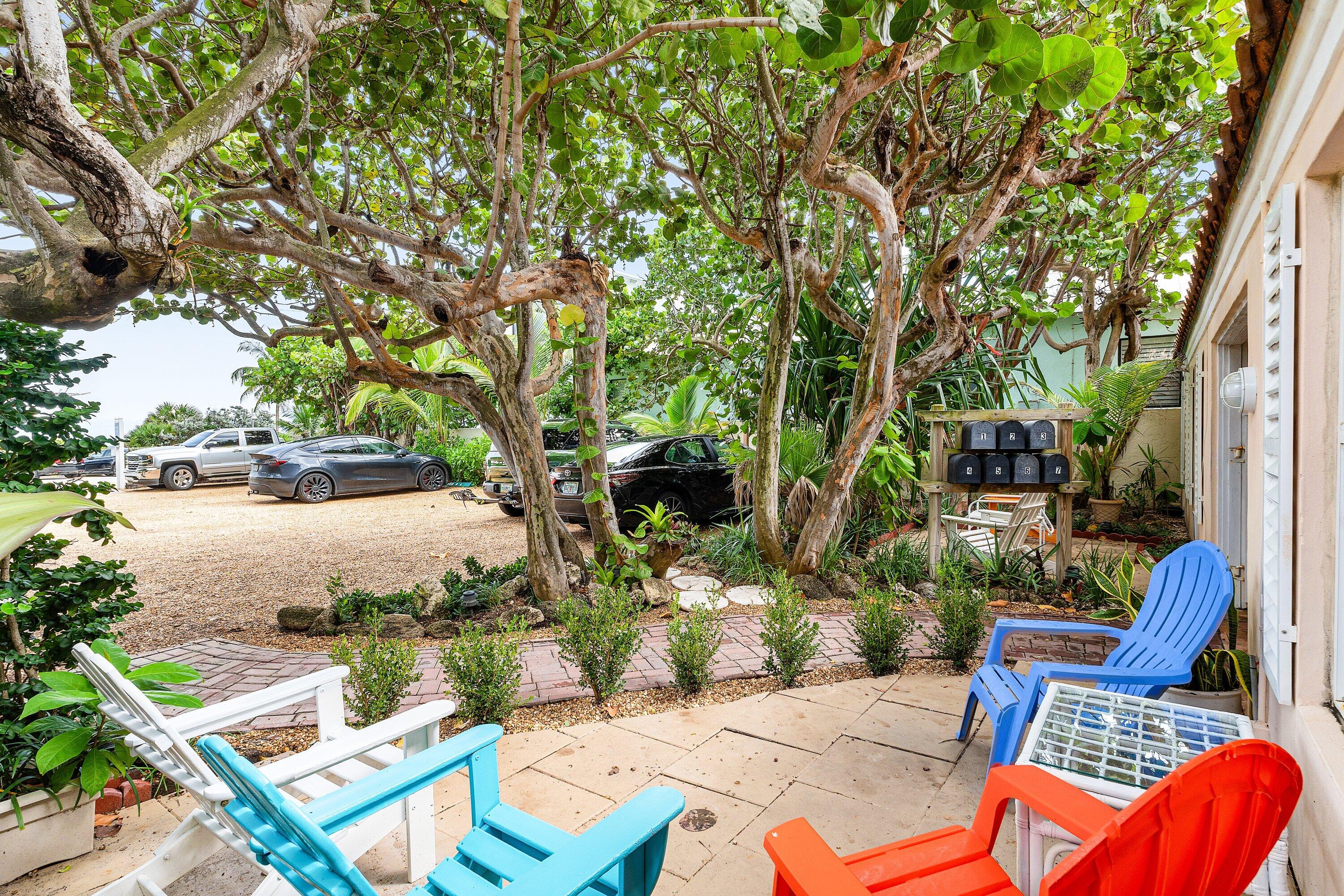 72 South Ocean Boulevard, Unit 1 Delray Beach, FL 33483 - Photo 20 of 35 a view of backyard with outdoor seating and trees