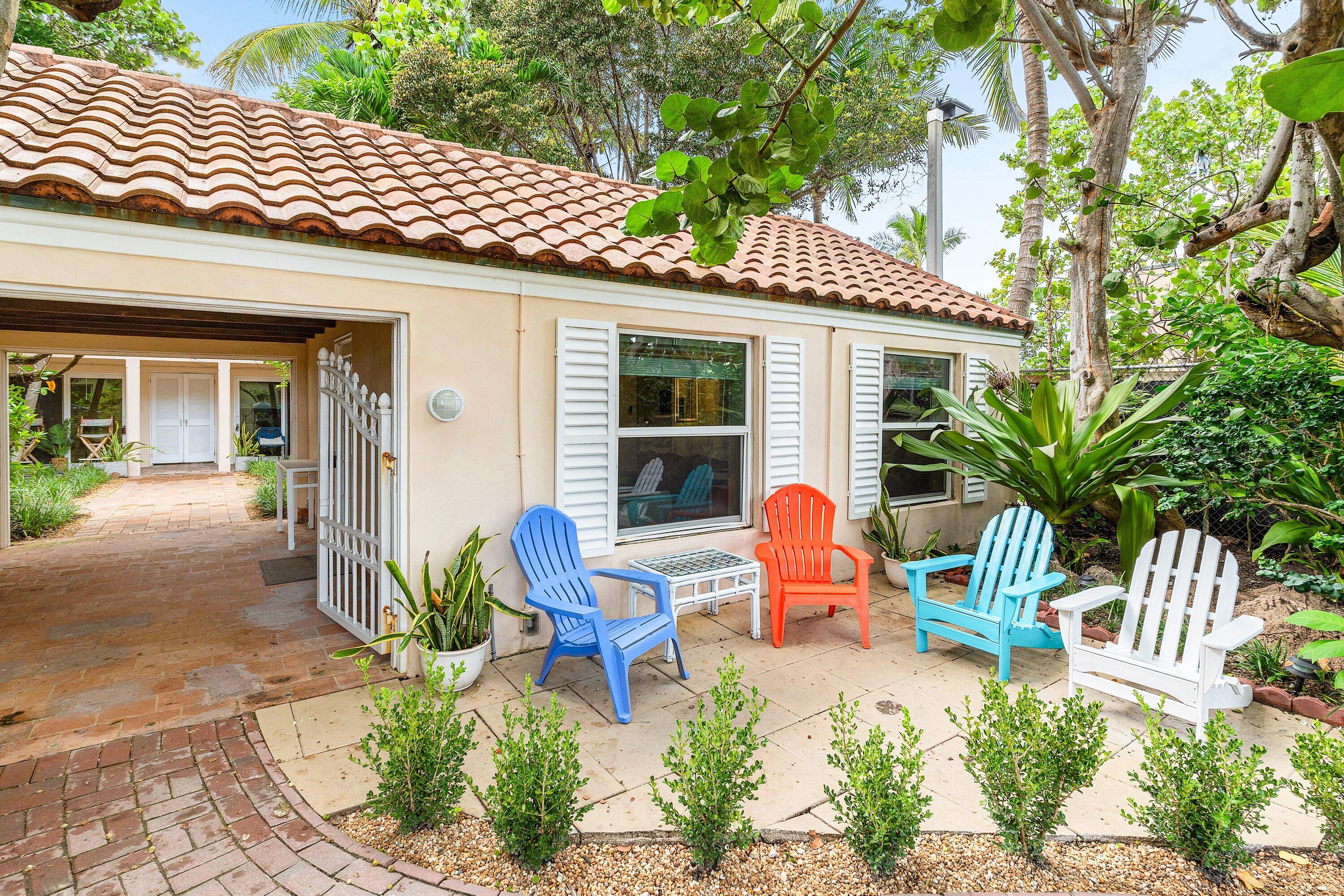 72 South Ocean Boulevard, Unit 1 Delray Beach, FL 33483 - Photo 2 of 35 a backyard of a house with outdoor seating