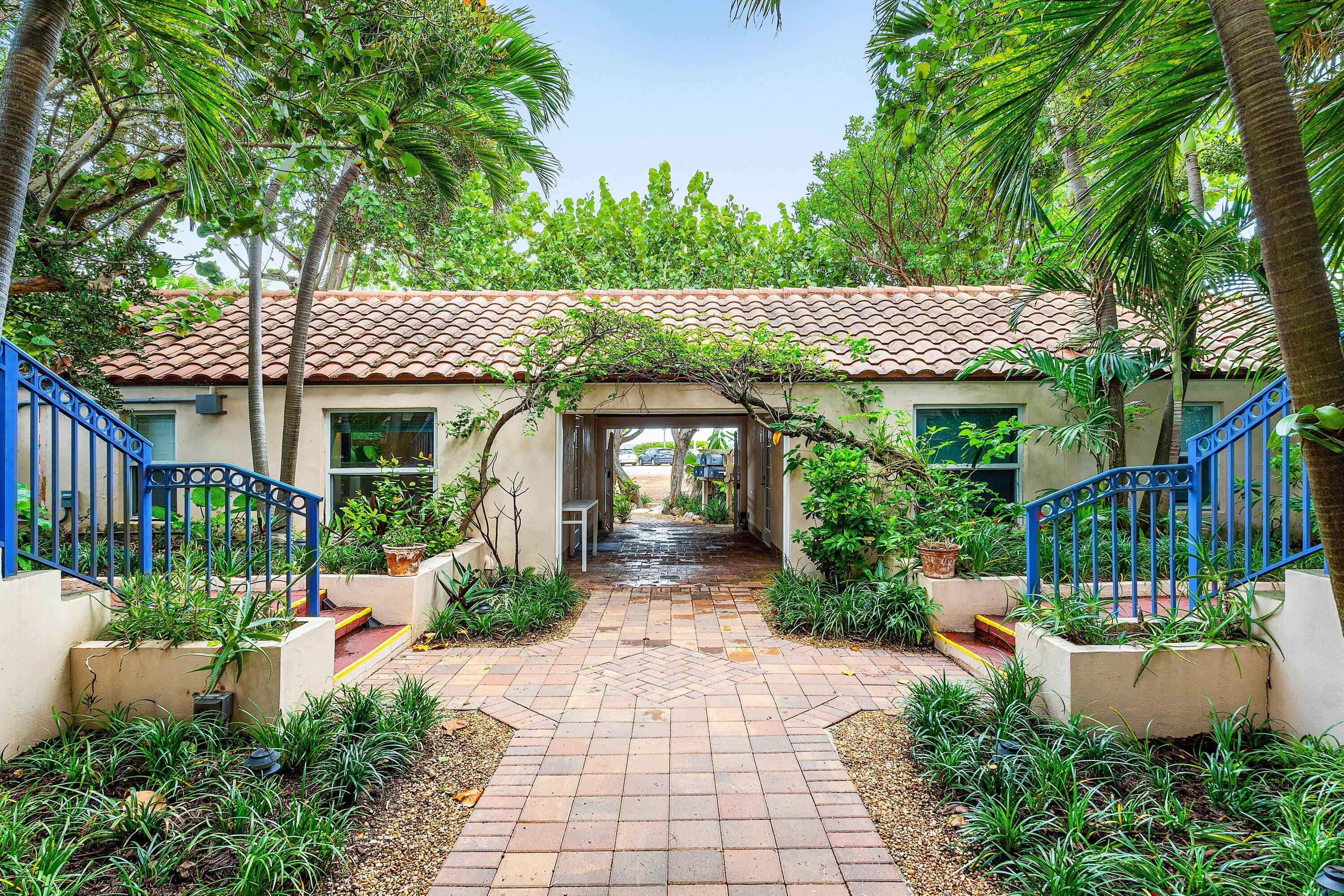 72 South Ocean Boulevard, Unit 1 Delray Beach, FL 33483 - Photo 21 of 35 a front view of a house with garden