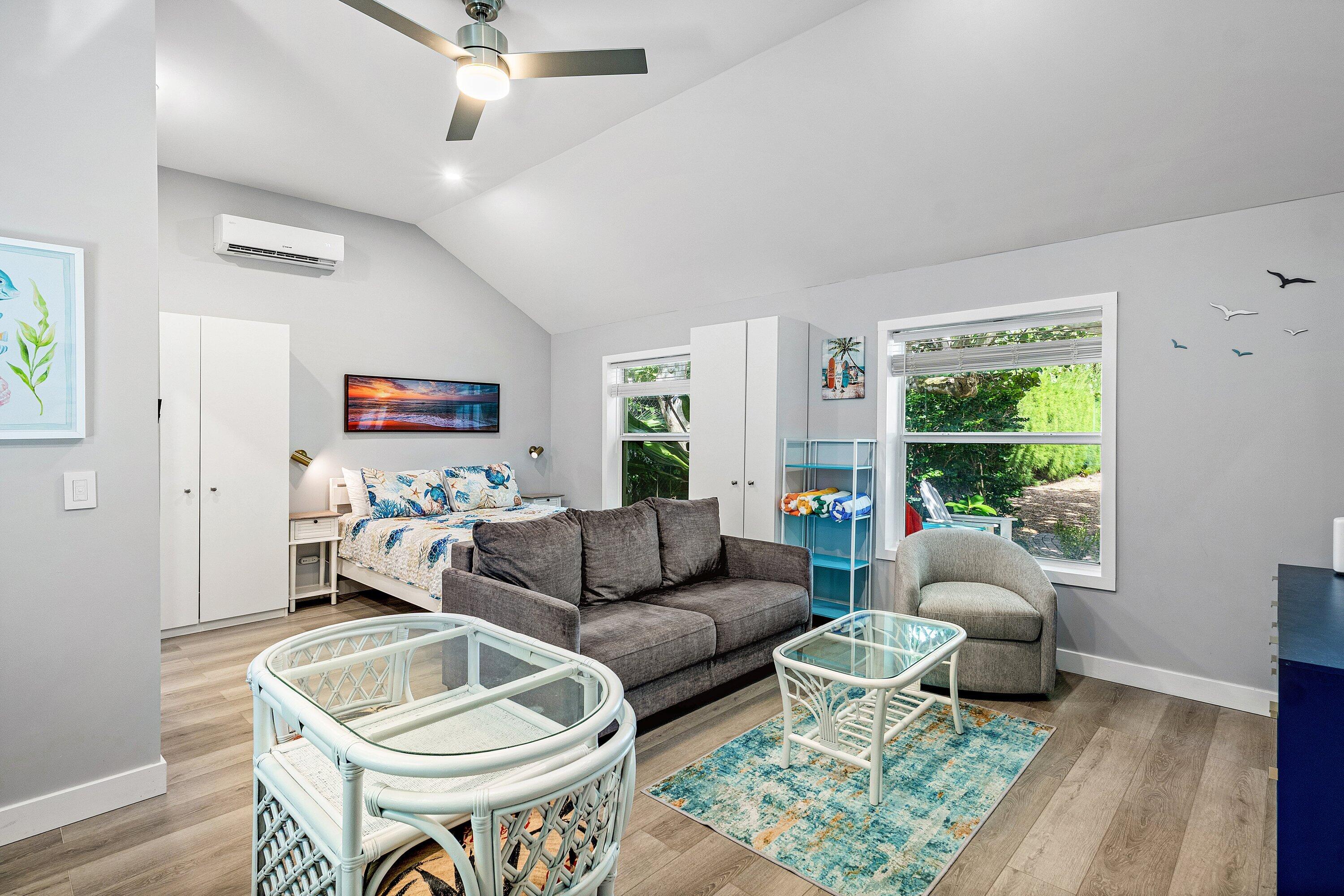 72 South Ocean Boulevard, Unit 1 Delray Beach, FL 33483 - Photo 4 of 35 a living room with furniture and a large window