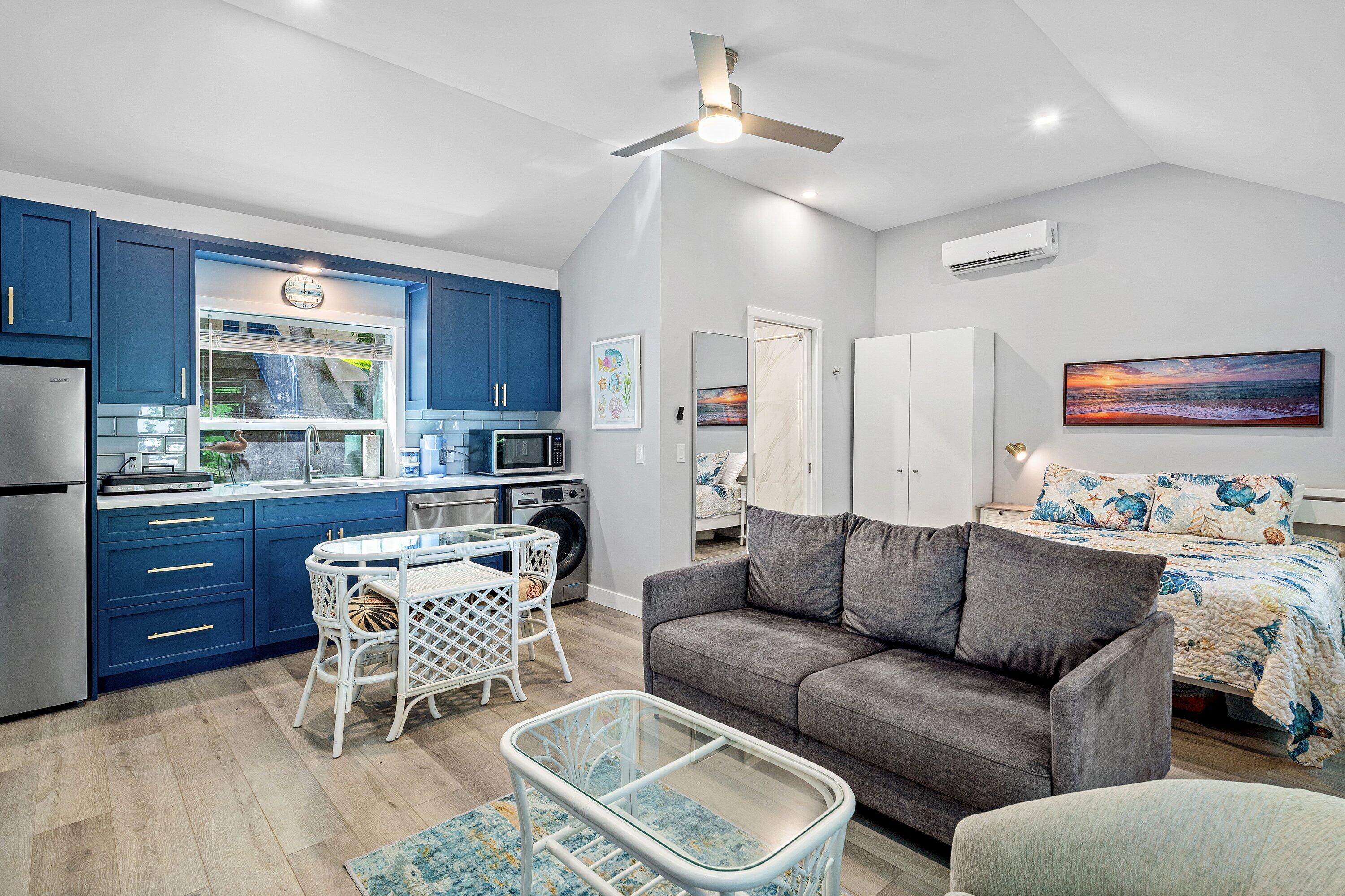 72 South Ocean Boulevard, Unit 1 Delray Beach, FL 33483 - Photo 5 of 35 a living room with furniture a ceiling fan and a window