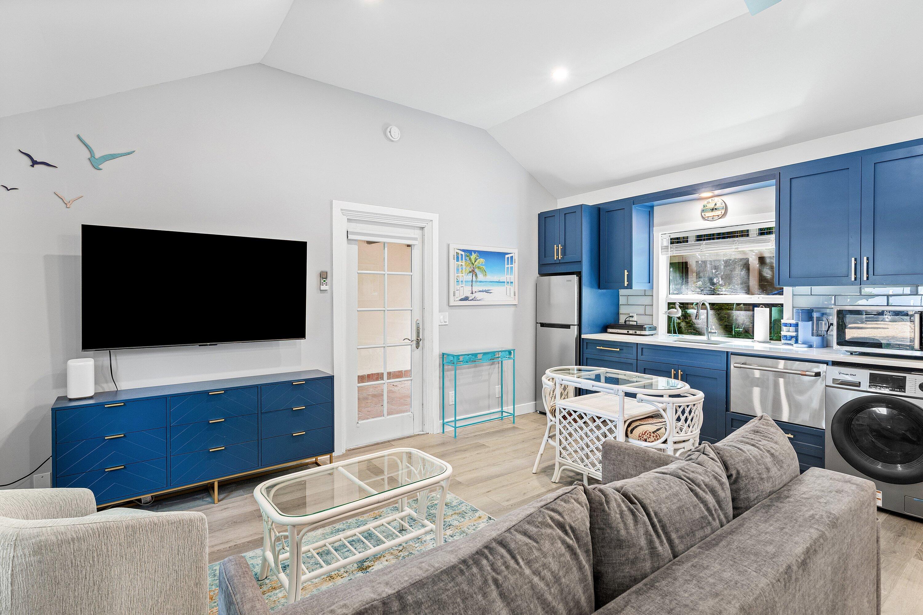 72 South Ocean Boulevard, Unit 1 Delray Beach, FL 33483 - Photo 6 of 35 a living room with furniture and a flat screen tv