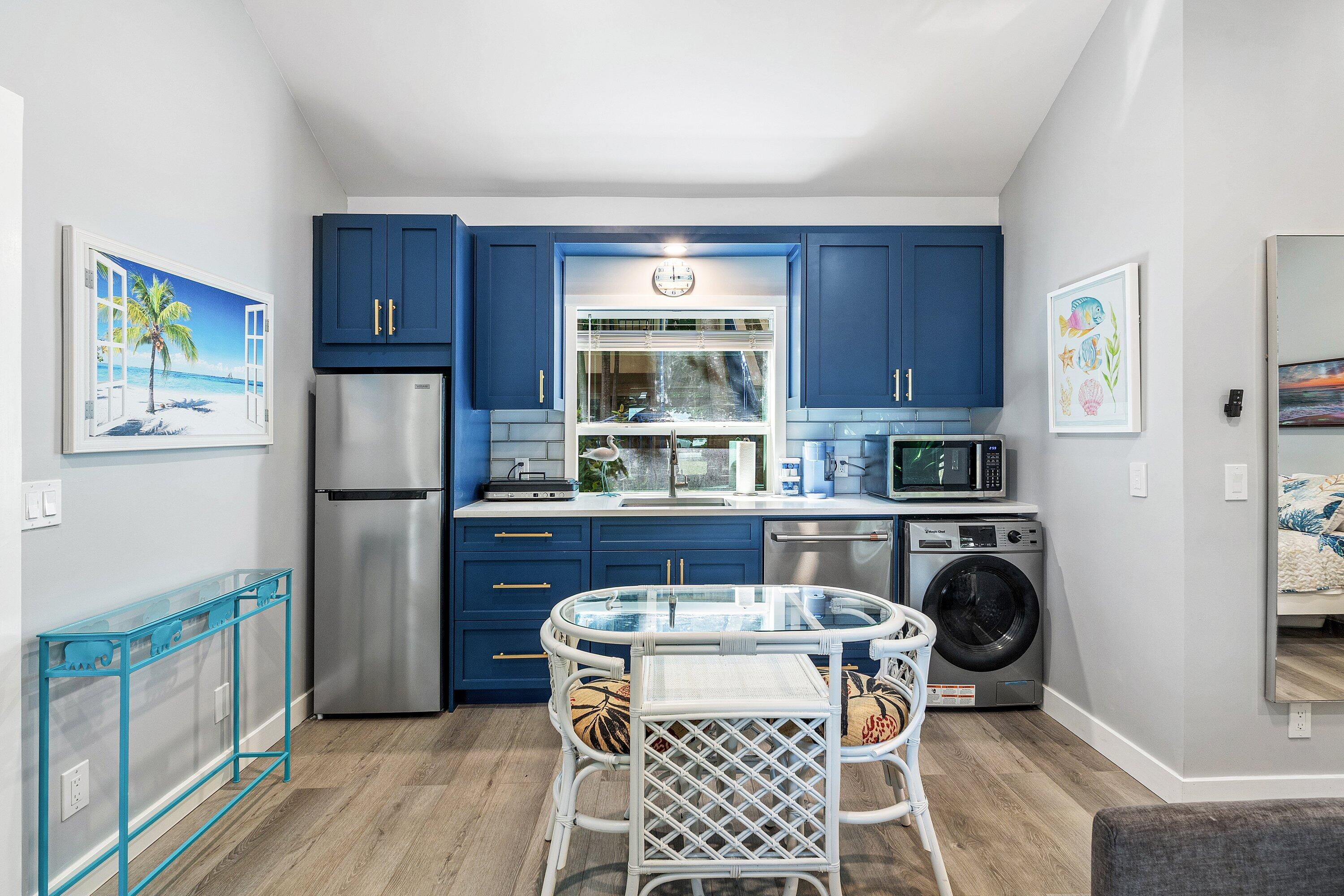 72 South Ocean Boulevard, Unit 1 Delray Beach, FL 33483 - Photo 10 of 35 a kitchen with a refrigerator and a stove top oven
