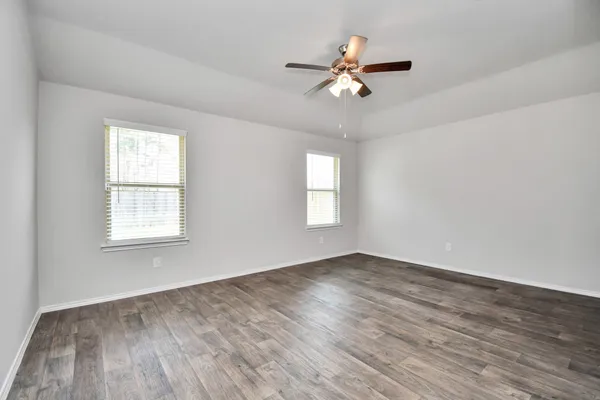 a bathroom with a sink a shower and a mirror
