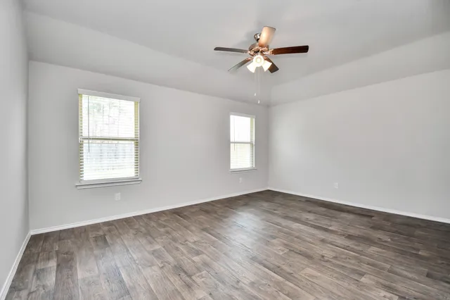 a bathroom with a sink a shower and a mirror