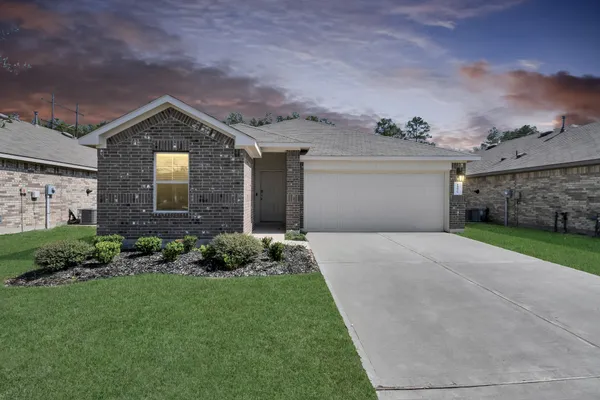 a fire hydrant in the middle of the grass