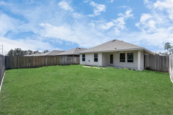 a kitchen with granite countertop stainless steel appliances and wooden cabinets