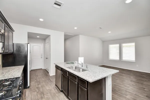a view of kitchen with cabinets and stainless steel appliances