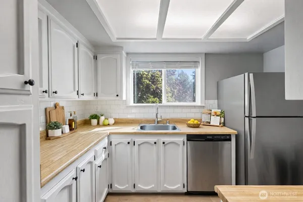 a view of a hallway with washer and dryer