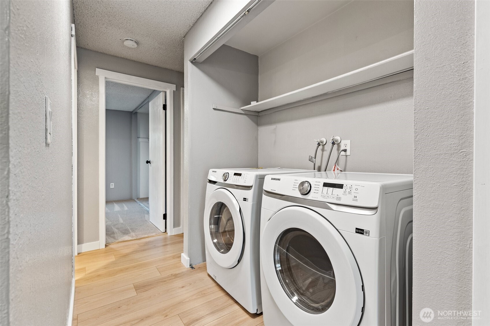 820 Cady Road, Unit H203 Everett, WA 98203 - Photo 13 of 30 a view of a hallway with washer and dryer