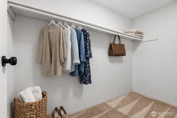 a bedroom with a bed and a table