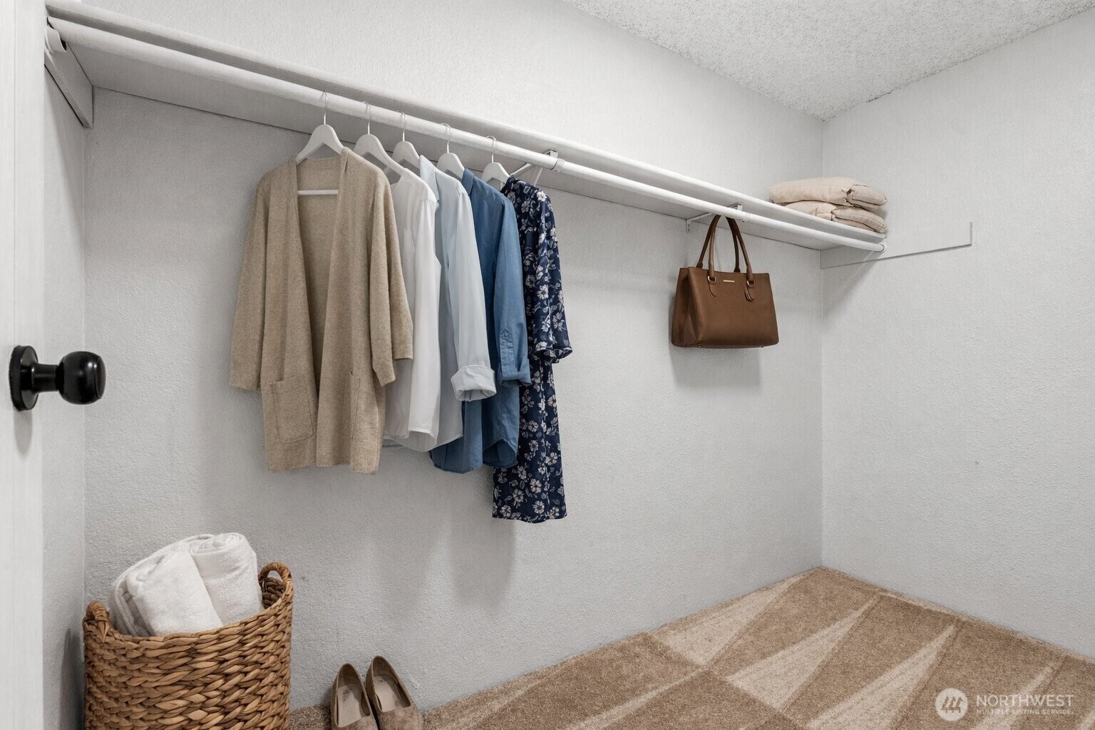 820 Cady Road, Unit H203 Everett, WA 98203 - Photo 19 of 30 a view of walk in closet with clothes and shoes