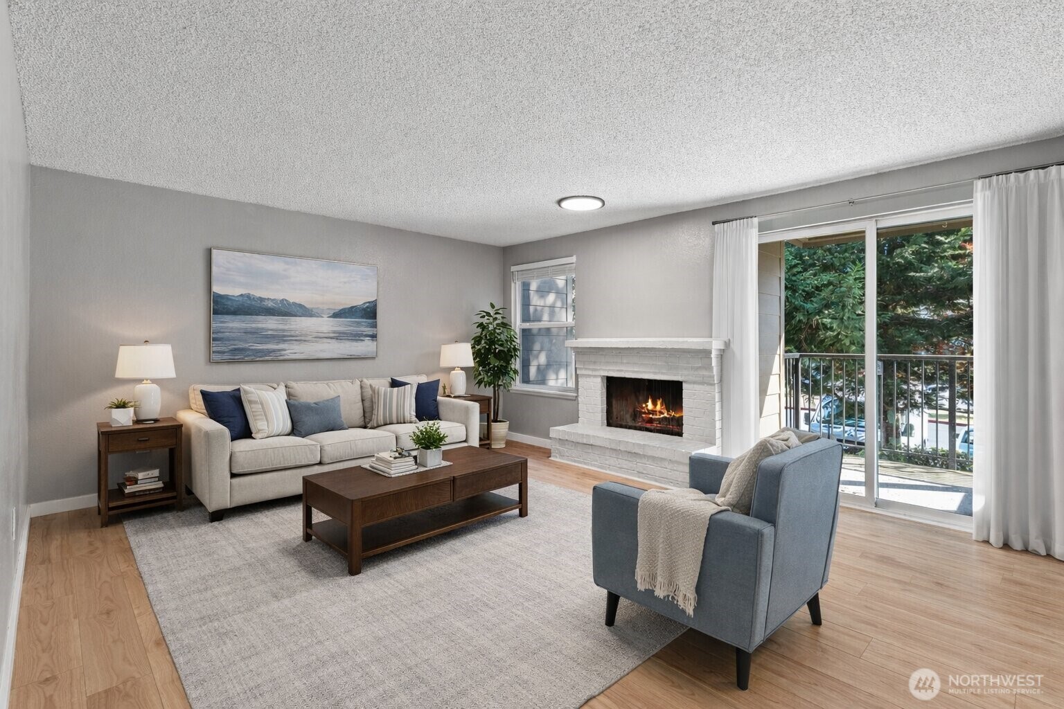 820 Cady Road, Unit H203 Everett, WA 98203 - Photo 6 of 30 a living room with furniture and a fireplace