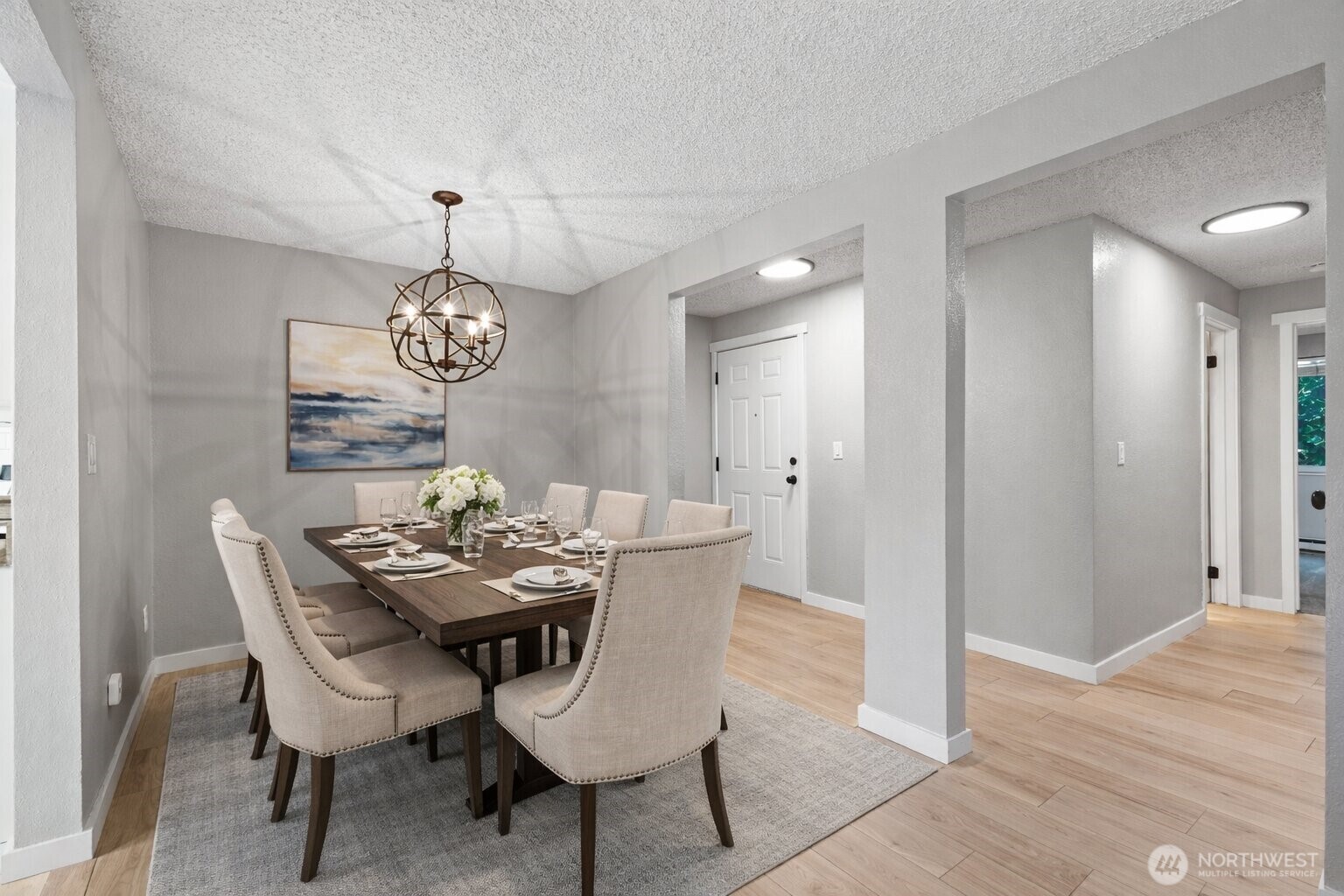 820 Cady Road, Unit H203 Everett, WA 98203 - Photo 9 of 30 a view of a dining room with furniture and chandelier