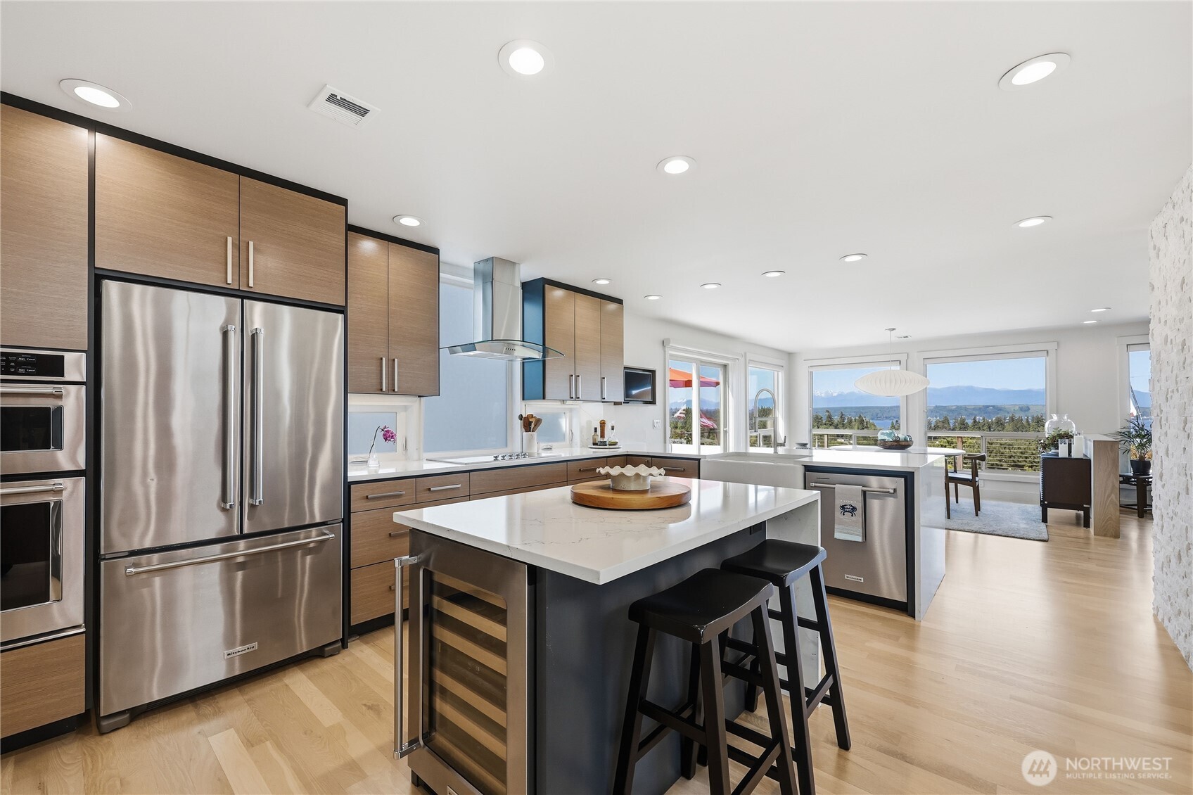 37709 Olympic View Road Northeast Hansville, WA 98340 - Photo 16 of 40 a kitchen with stainless steel appliances a refrigerator and a stove